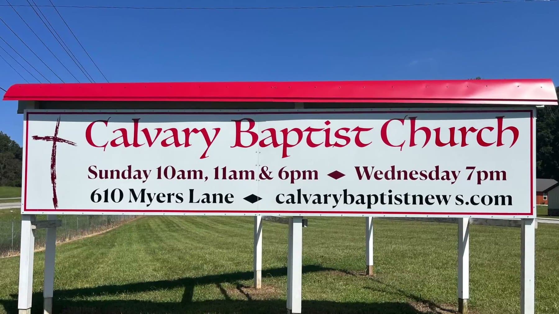 The Calvary Baptist Church sign at the road: Sunday 10am, 11am and 6pm, Wednesday 7pm, 610 Myers Lane
