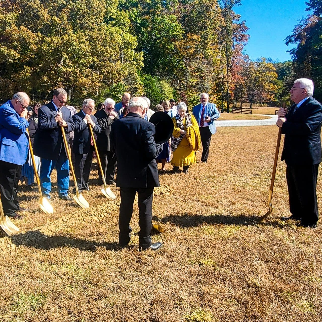 Members of Calvary Baptist Church standing with gold shovels at the groundbreaking for the new church building